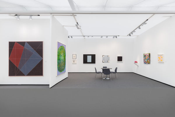 image of an art fair booth with various items hung on the walls