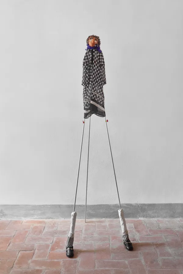 Luca Parise, Manuela (she/her), 2024/25, Bisque-fired ceramic, glazed ceramic, aluminium, babybell wax, shirt, scarf, sock, and shoes, cm 210 (h) x 60 x 80 Courtesy of the artist and z2o Sara Zanin, Ph. Camilla Maria Santini