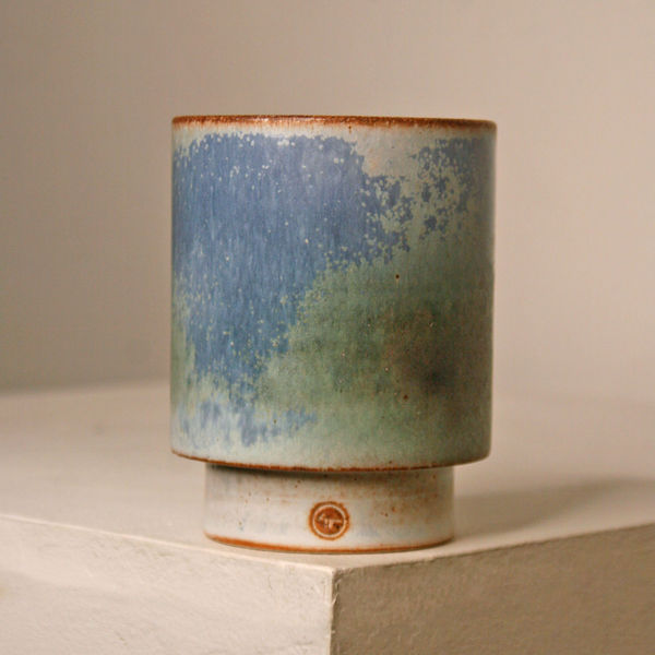 Atilla Olah ceramic yunomi cup in a variety of blue, green, grey and copper glaze colours