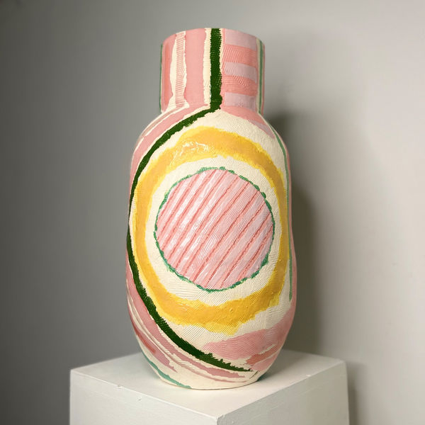 Eddie Knevett ceramic vessel designed with shaped in colours pink, green, and yellow