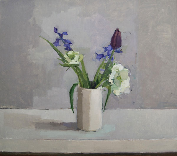Sarah Spackman still life painting of spring flowers in a ceramic vase on a grey background