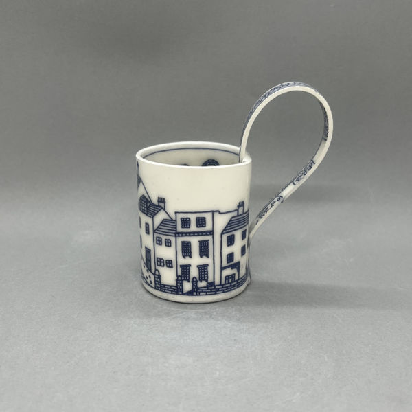 Janine Roper cup with blue and white design of a street
