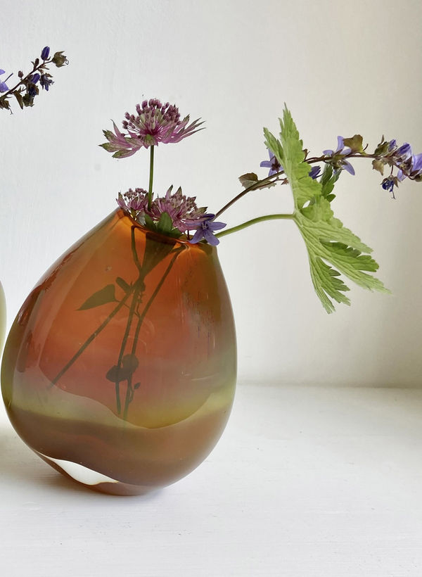 Michele Oberdieck small round glass vessel in colours of orange and olive green.