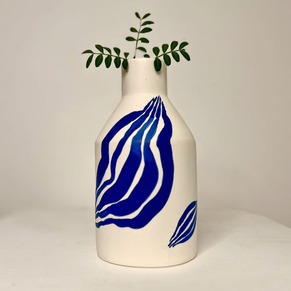 Sophie Alda diamond shaped ceramic bottle vase with hand painted Yves Klein Blue leaves