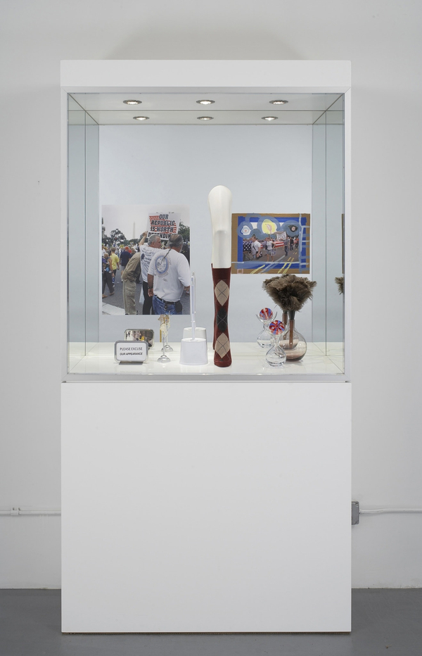 Josephine Meckseper I Love Jesus2005 Aluminium, plexiglass, glass, lights, c-print, metal display stands, plastic mannequin leg, argyle sock, found jewellery, gouache and tape on inkjet print mounted on cardboard, toilet brush, feather duster, acrylic on glass ball, glass vases 89 x 46 x 18 in. 226 x 117 x 46 cm