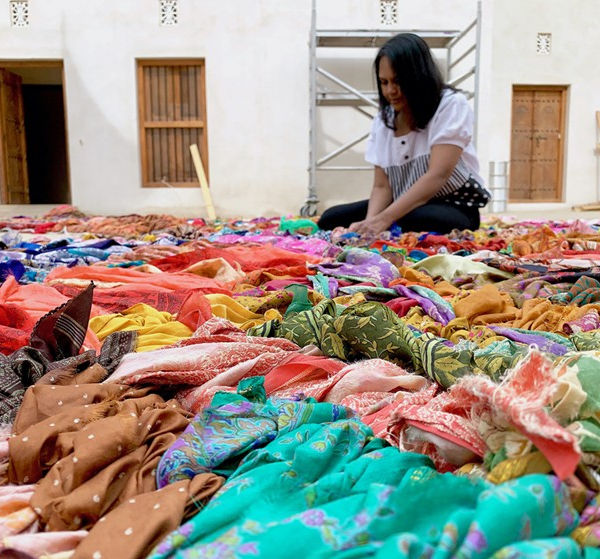 Suchitra Mattai with sari tapestries in Sharjah, India.Sharjah Foundation