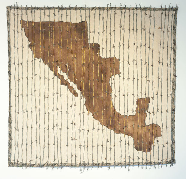 Mi Oro, Tu Amor, translating to 'my gold, your love,' Mexico is visible but barred behind slats of barbed wire...