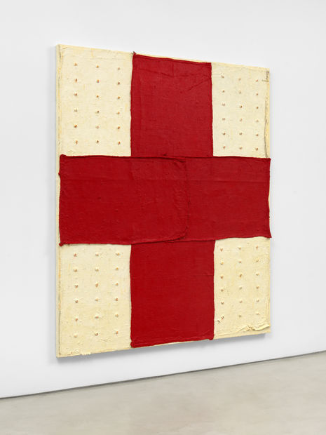Contending that the “body is always near,” Hammond’s use of materials in Red Cross elicit notions of the canvas as...