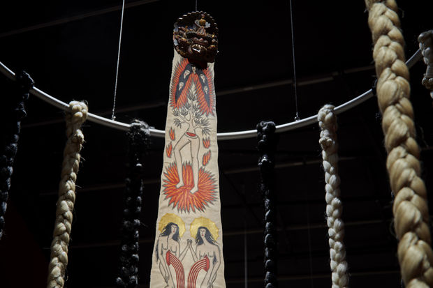 Act Two, 2024, Acrylic on python skin, artificial hair, and found wooden carved mask, Dimensions variable.