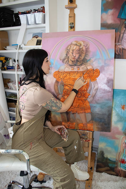 artist Alex Garant in her studio painting