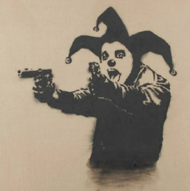 Banksy’s 2001 Insane Clown presents haunting masked figure, early example of fear and satire.