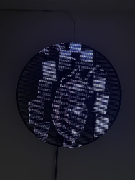 Rossin's paintings hint at the hidden infrastructure of our digital age—layered landscapes, UI fragments, and ghostly figures that feel both...