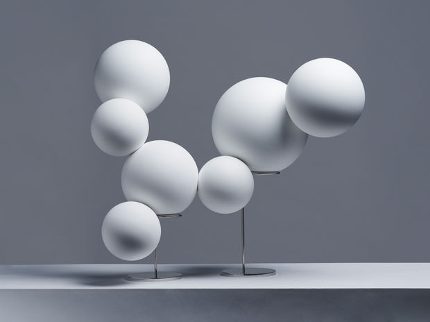 The balloons, now a visual beacon, interact with these settings to emphasize the duality between reality and the reconstruction of...