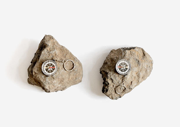 All at Sea, Two basalt stones from the Golan Heights and two compasses, dimensions variable