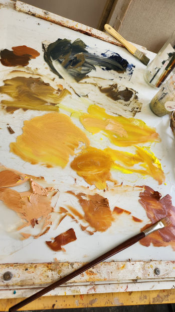 earth toned paint smears on palette