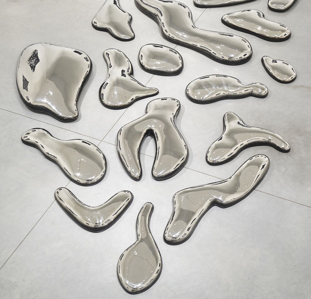In 'CLOUDS', stainless steel cloud-like shapes surround the floors of the gallery. They echo, reflect, and complement the lines in...