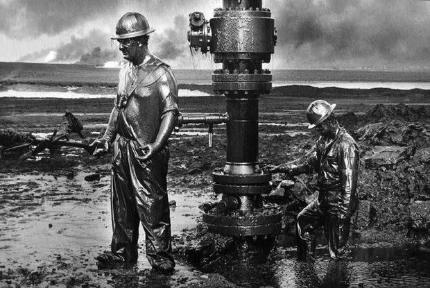 THE POWER OF PHOTOGRAPHY DIII, Workers install a new wellhead to enable the injection of a chemical mud to 'kill...