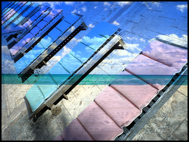 In this work the geometry of empty chairs dissolves into the horizon. Sea, sky, and perspective blur into one, a...