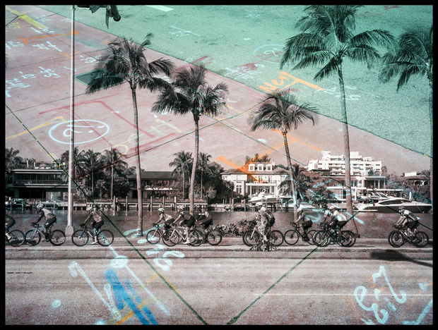 This photograph captures the contrast between the idealized postcard image of Miami and the layered complexity beneath it. A layered...