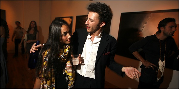 IN THE PICTURE Katie Schecter, left, with Carlo von Zeitschel at his gallery party and book signing for the photographer Paolo Pellegrin. Credit Rahav Segev for The New York Times