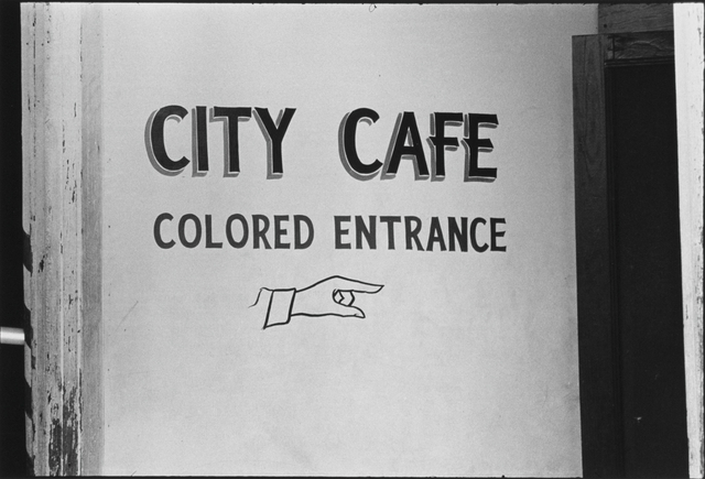 Danny Lyon b. 1942 The entrance to the City Caf&eacute;, Selma, Alabama, 1964 Signed, dated, and annotated, in pencil, with Bleak Beauty printer stamp, in ink, au verso Printed by Lupe Alvarez in 1993 Gelatin silver print 8 &frac34; x 12 &frac34; inch (22.23 x 32.39 cm) image 11 x 14 inch (27.94 x 35.56 cm) paper