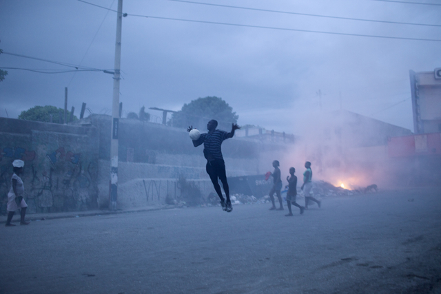 Benoit Aquin b. 1963 L'envolée, Port-au-Prince, Haïti, 2010 Signed, titled, dated and editioned, in pencil, au mount verso Printed in 2012 Pigment print on 26 x 36 inch (66.04 x 91.44 cm) archival paper flush-mounted to archival board 20 x 30 in 50.8 x 76.2 cm Edition of 2 (#1/2)