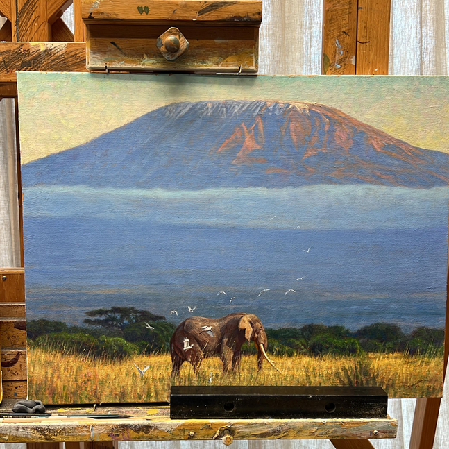 John Banovich
The Last Crossing, 2026
oil on Belgian linen
20h x 26w x 1d in
50.80h x 66.04w x 2.54d cm
$ 27,500.00
&amp;nbsp;

Looking out across the open plain, I thought of Craig, the great tusker of Amboseli. I pictured him emerging from the tall grass, his long tusks nearly touching the ground, his presence unmistakable against the wide landscape and the distant rise of Mount Kilimanjaro. For decades, he embodied the true spirit of the wild&amp;mdash;steady, resilient, and shaped by time. Above him, birds drifted across the sky, unchanged, as the land carried on around him.

Born in the early months of 1972, Craig survived decades in a world where so many of his kind were lost to the ruthless ivory trade. He became one of the last of the &amp;ldquo;super tuskers,&amp;rdquo; his ivory tusks weighing 125 and 145 lbs, as he wandered his ancient routes beneath Kilimanjaro&amp;rsquo;s gaze.

In this painting, I&amp;rsquo;ve frozen a single, silent moment: he pauses at the edge of memory and myth, a lone wanderer touched by the golden warmth of the grass and the cool hush of approaching dusk. I wanted his presence to feel monumental yet peaceful, an ode to his storied life and the many calves whose futures he helped shape.

Craig passed away in the early hours of January 3, 2026, his molars worn down with age and his great body weary from years of roaming free. Rangers and guardians kept vigil by his side through his final hours, honoring a creature who gave so much to the land he called home. His death was not sudden or violent, but one of old ag. A reminder of the beauty that remains when wild things are protected and allowed to live out their lives in peace.

Craig&amp;rsquo;s journey becomes a peaceful step from the world he knew into the legacy he leaves behind.