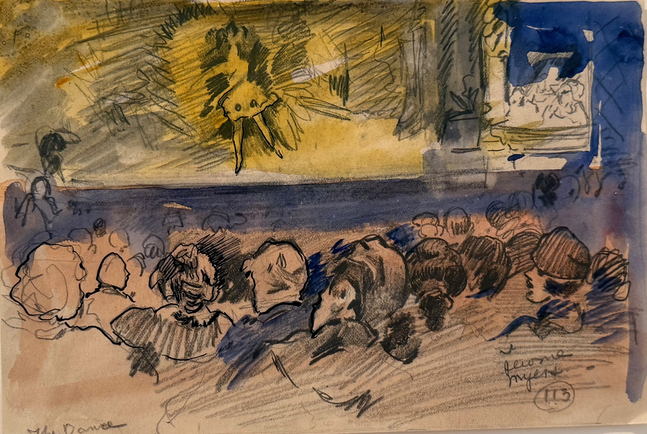 view of a dancer on a stage with audience in the foreground