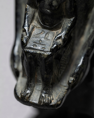 Egyptian theophorous figure, holding a seated statuette of Imhotep, Late Dynastic Period, 27th-30th Dynasty, c.525-343 BC