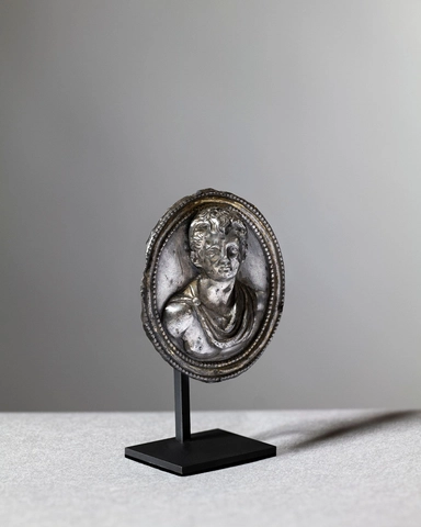 Roman medallion of a young man in relief, c.1st century AD