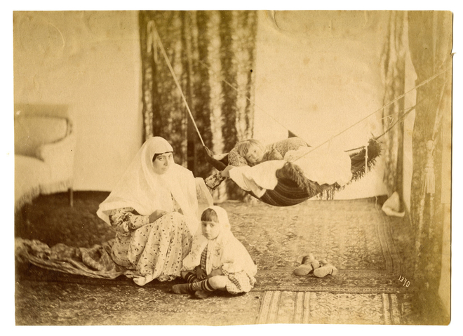 Antoin Sevruguin, A woman with two children in the andaruni, Late 19th Century