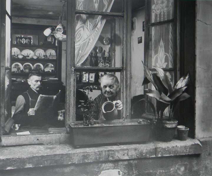 Man at Flea Market with Vinyl Player, France, c.1950 Gelatin silver print 9 5/8 x 11 1/2 in. © Robert Doisneau