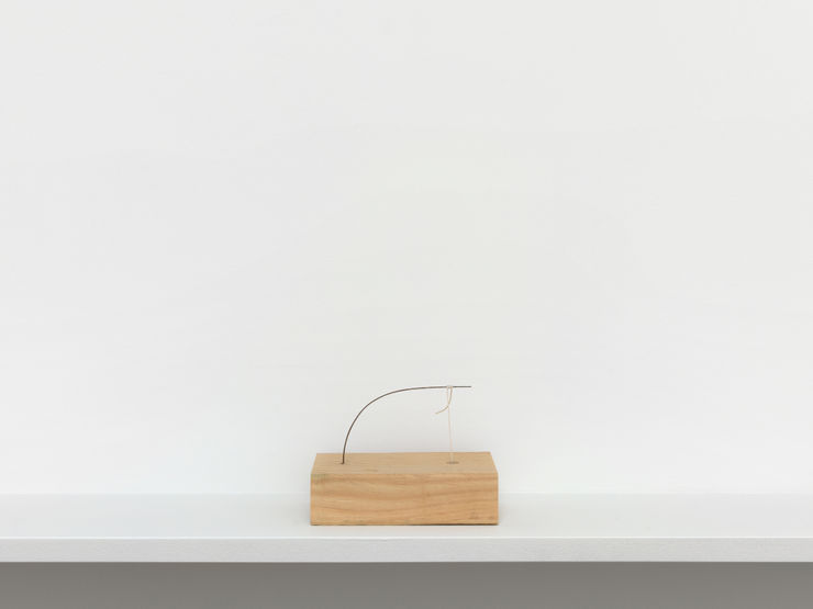 Eric Oglander Hotdog on a string down a crawdad hole, 2024 Pine, nylon string, street sweeper bristle, epoxy, india ink 13.34 x 8.89 x 9.84 cm 5.25 x 3.5 x 3 7/8 in