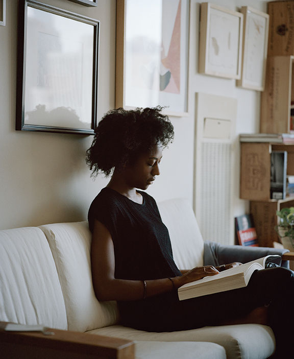 Carrie Schneider, Naomi reading Adrian Piper (Out of Order, Out of Sight, Vol. I: The Selected Readings of Meta-Art 1968-1992, pub. 1999) from Reading Women, 2014
