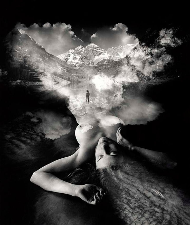 A black and white silver gelatin print of a nude woman merged with the sky by slate gray gallery artist Jerry Uelsmann