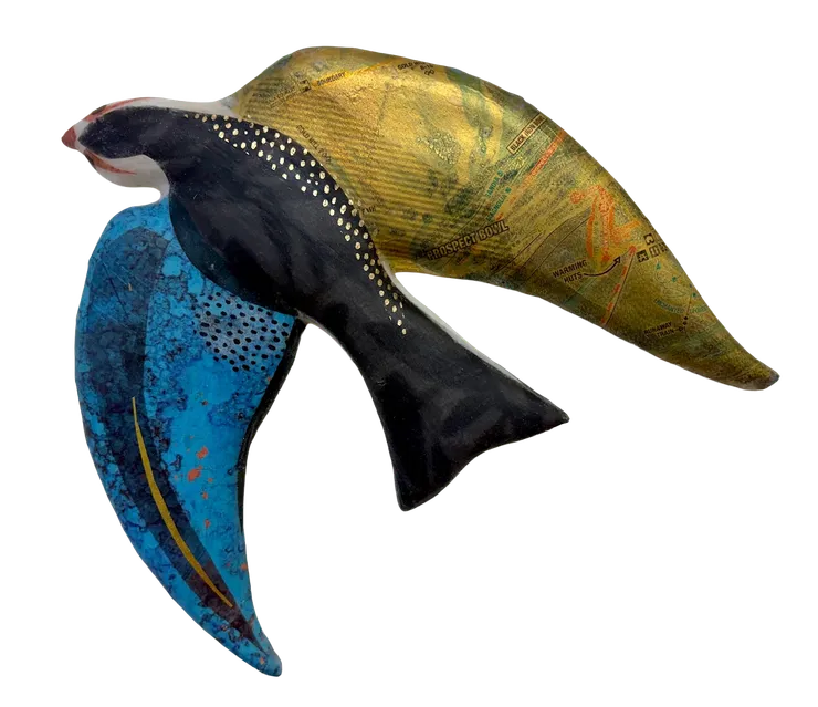 a clay swallow made by Julie McNair which depicts a map of the Telluride Ski Resort and has blue, black, and golden elements.