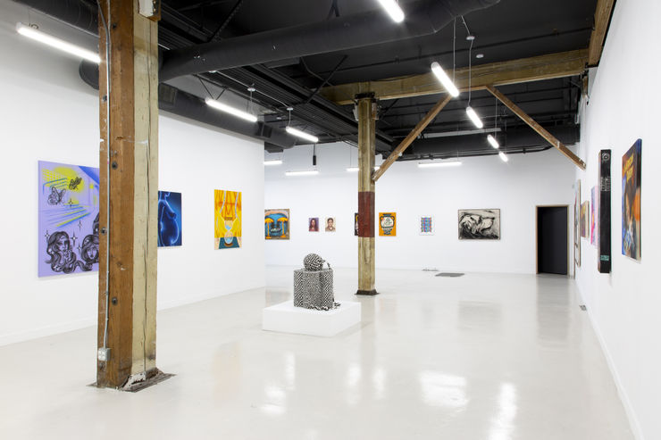 photo of the layout of the gallery with paintings on the walls