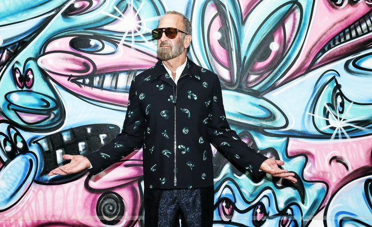 Kenny Scharf in front of the NYAA mural which became the new edition