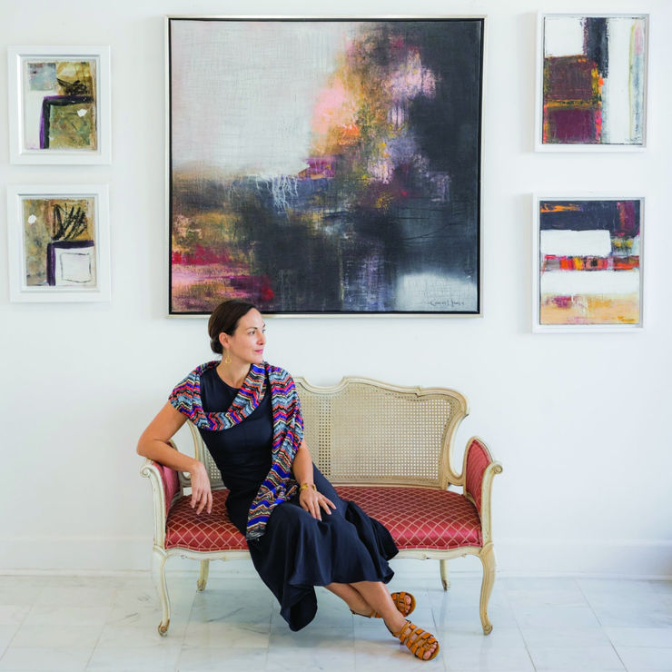 Carla Groh, photographed in front of works by Carlos Llanes, in her Palm Beach gallery, Evey Fine Art.