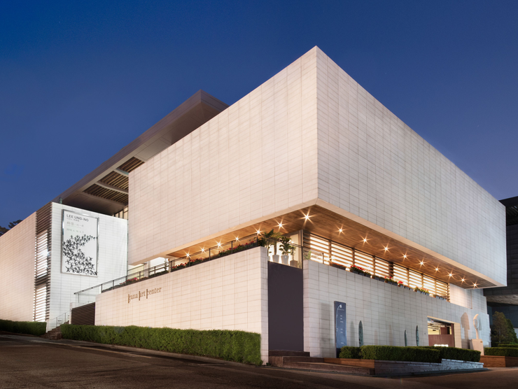 The exterior of Gana Art's large modernist building.