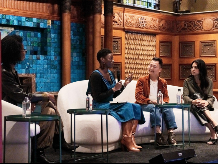 Three speakers and a moderator onstage at The Photography Show