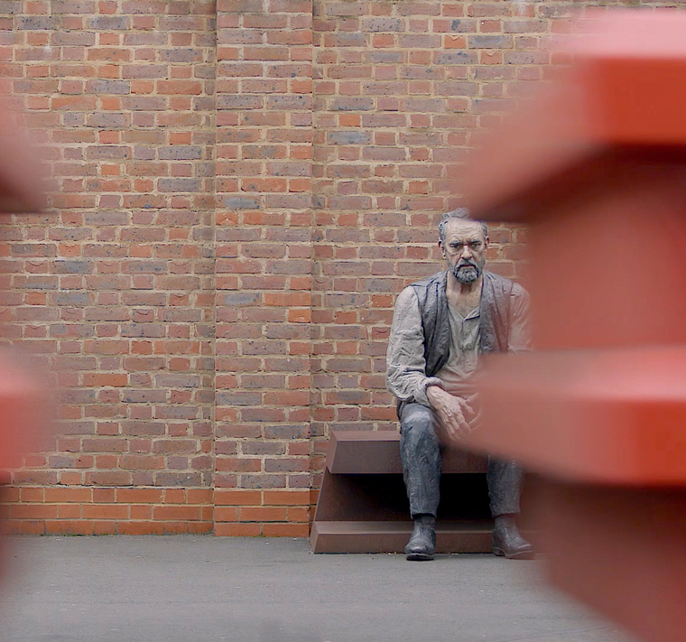 Seated Man, installed on Platform 1 of Woking Train Station