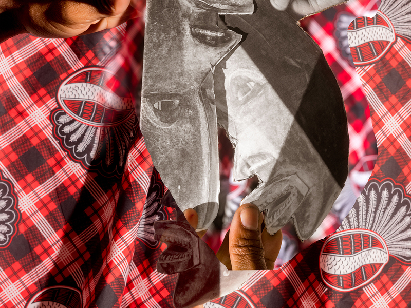 A black and white photo of African masks is collaged and held up by the artist's hands over a traditional colorful cloth.