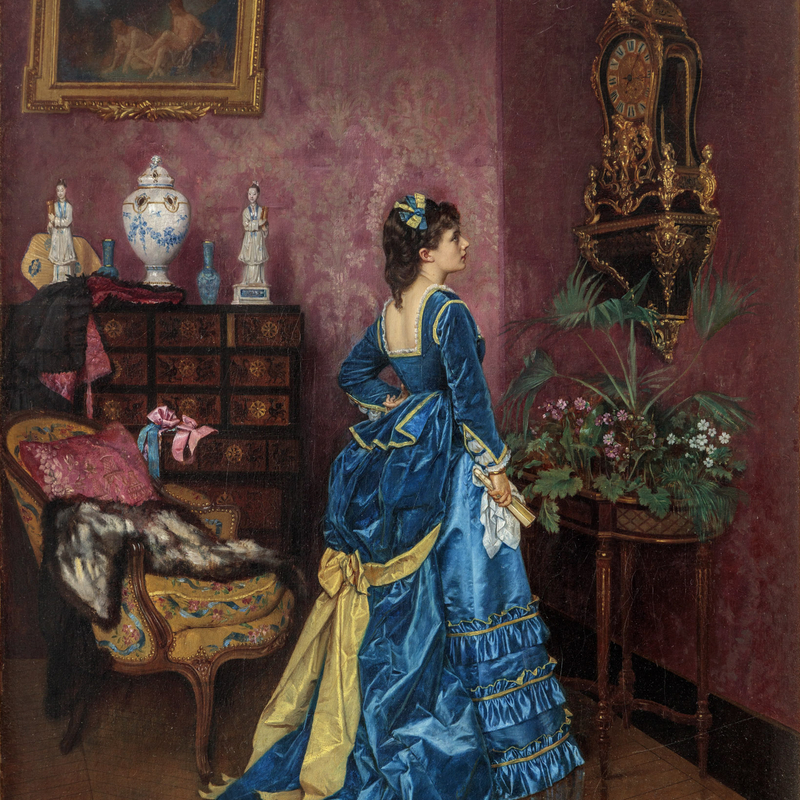 ELEGANT WOMAN IN AN INTERIOR
