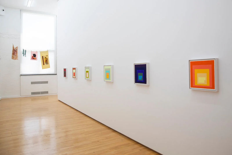 A view of the Perimeter Gallery with Steve Locke’s “Homage to the Auction Block” (2020), right, with the shape of an auction block at the center of Josef Albers, and Tyler Mitchell's “Laundry Line” (2020) at the back. Credit: Lauren Lancaster for The New York Times