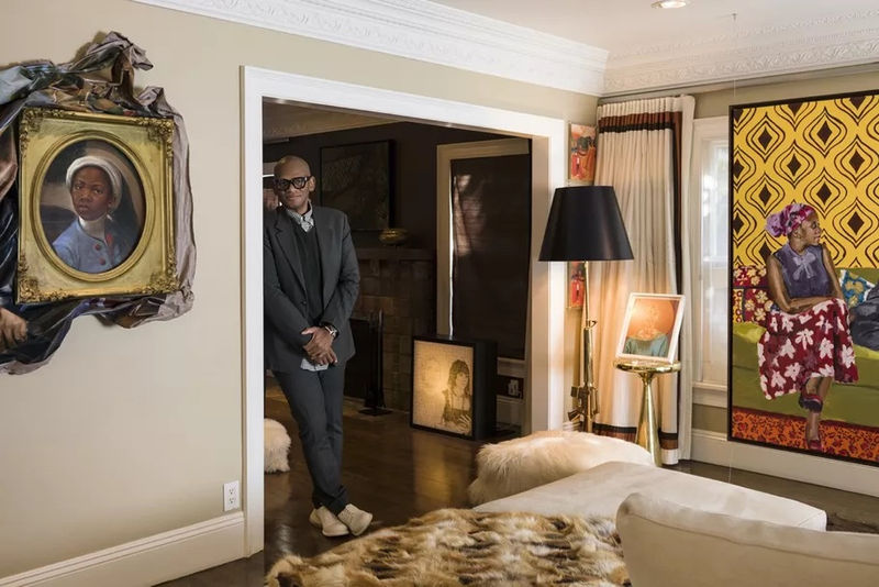 Portrait of Arthur Lewis with his collection, featuring Titus Kaphar, "Enough About You," 2016; Kenturah Davis, Untitled 2, 2013; and Wangari Mathenge, "The Ascendants (Now and Then)," 2019. Photo by Jeff McLane. Courtesy of the artists and Arthur Lewis.