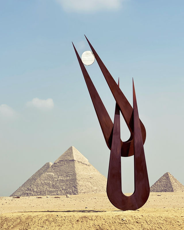 International art exhibition in front of pyramids