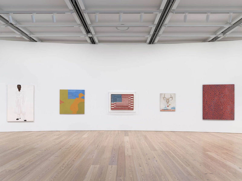 Installation view of “Untitled” (America) (Whitney Museum of American Art, New York, July 5, 2025-). From left to right: Barkley L. Hendricks, Steve, 1976; Kay WalkingStick, April Contemplating May, 1972; Jasper Johns, Three Flags, 1958; Georgia O’Keeffe, Summer Days, 1936; Alma Thomas, Mars Dust, 1972. Photograph by Ron Amstutz
