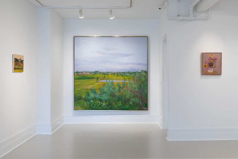 The gallery space converging towards a large green ground and blue skied Jane Freilicher, "Thicket and Field".