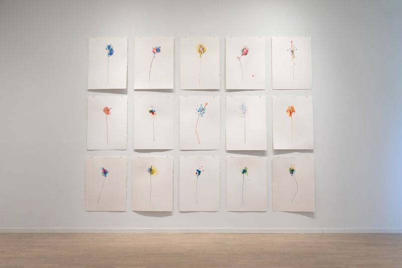 Fifteen Gustavo Bonevardi floral paintings on paper, arranged three by five.